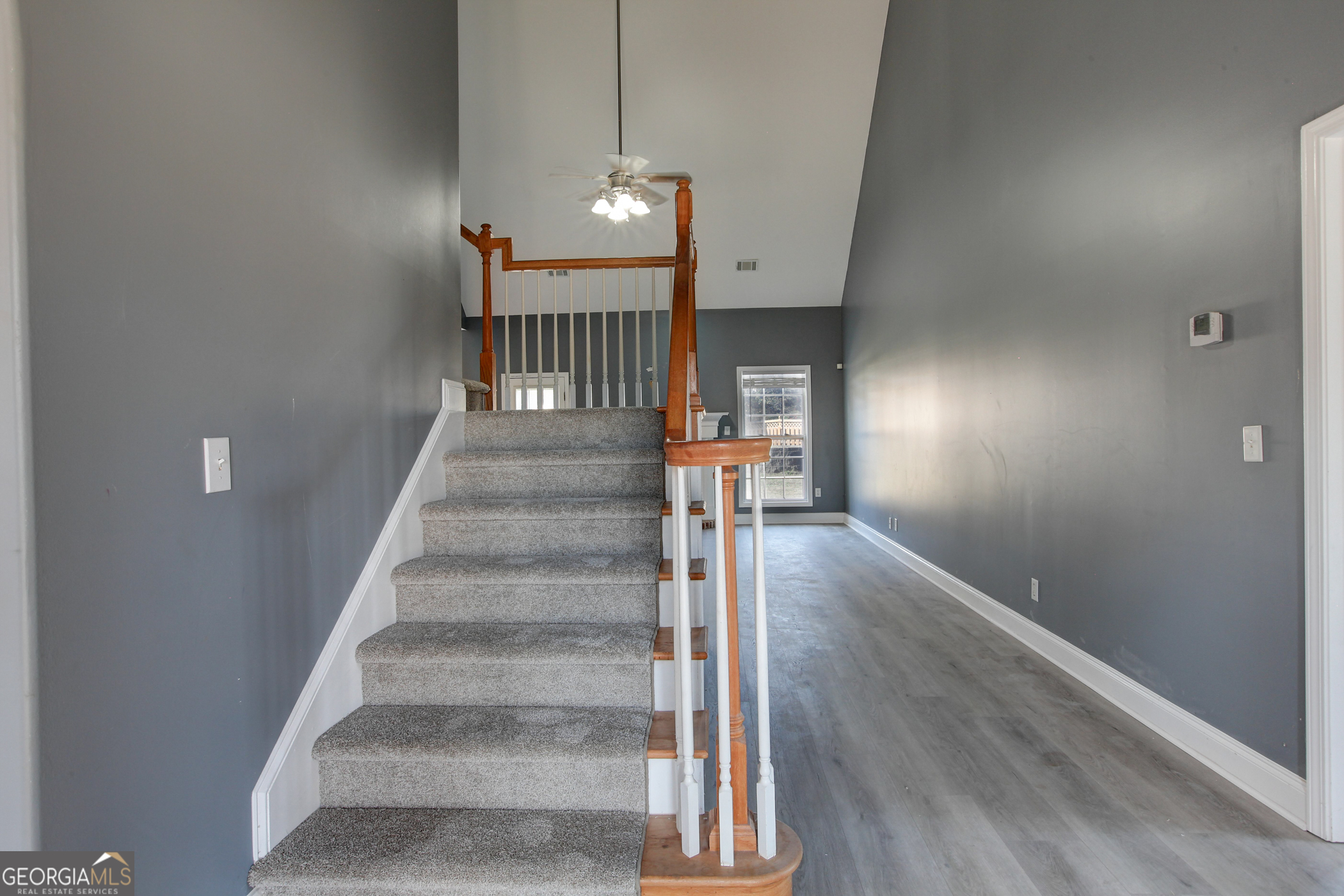 500 Soho Place Locust Grove, GA 30248 - Photo 5 of 26 a view of entryway and hall with wooden floor