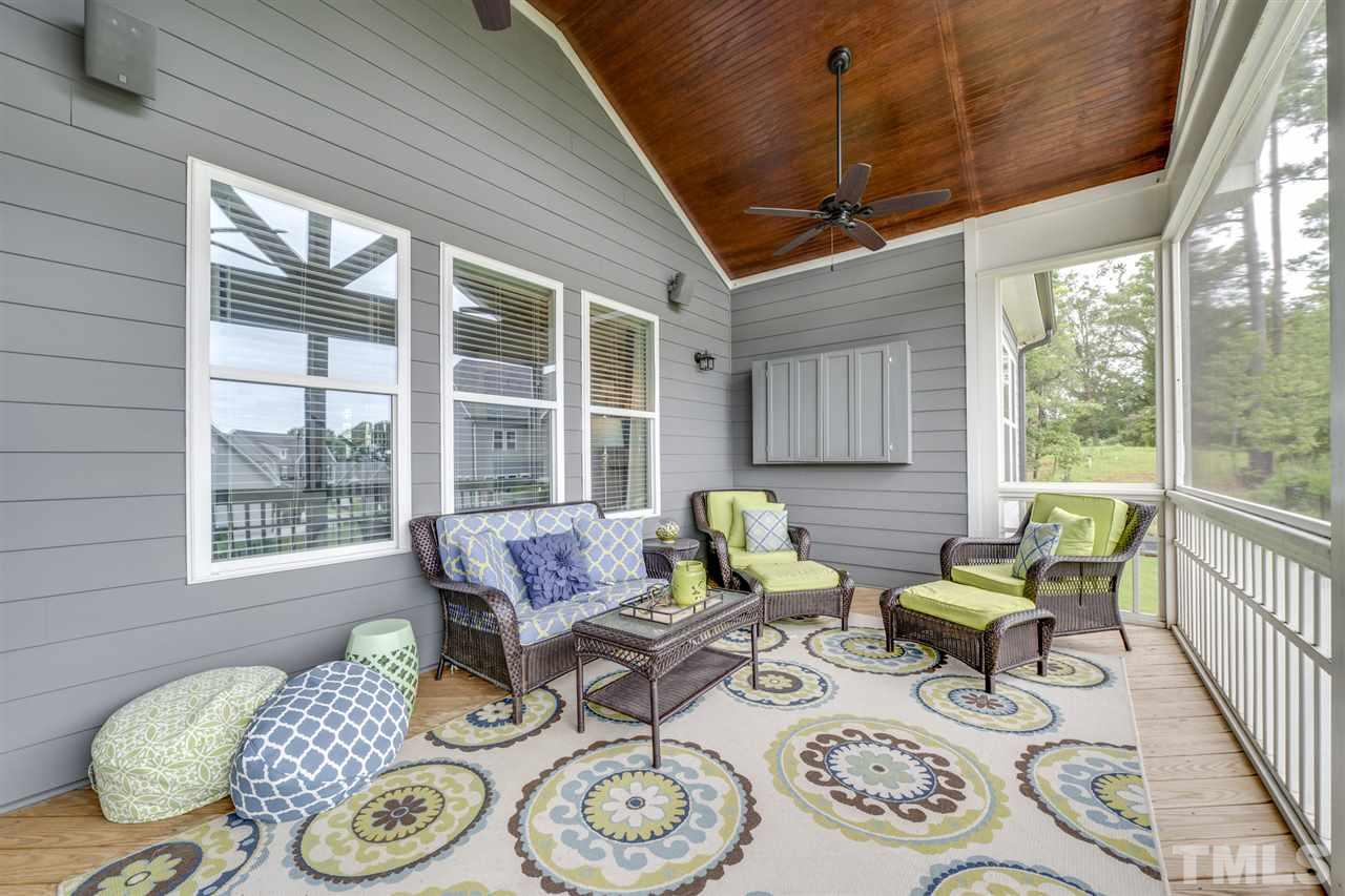 7504 Pinaster Place Raleigh, NC 27613 - Photo 11 of 30 a living room with furniture and wooden floor