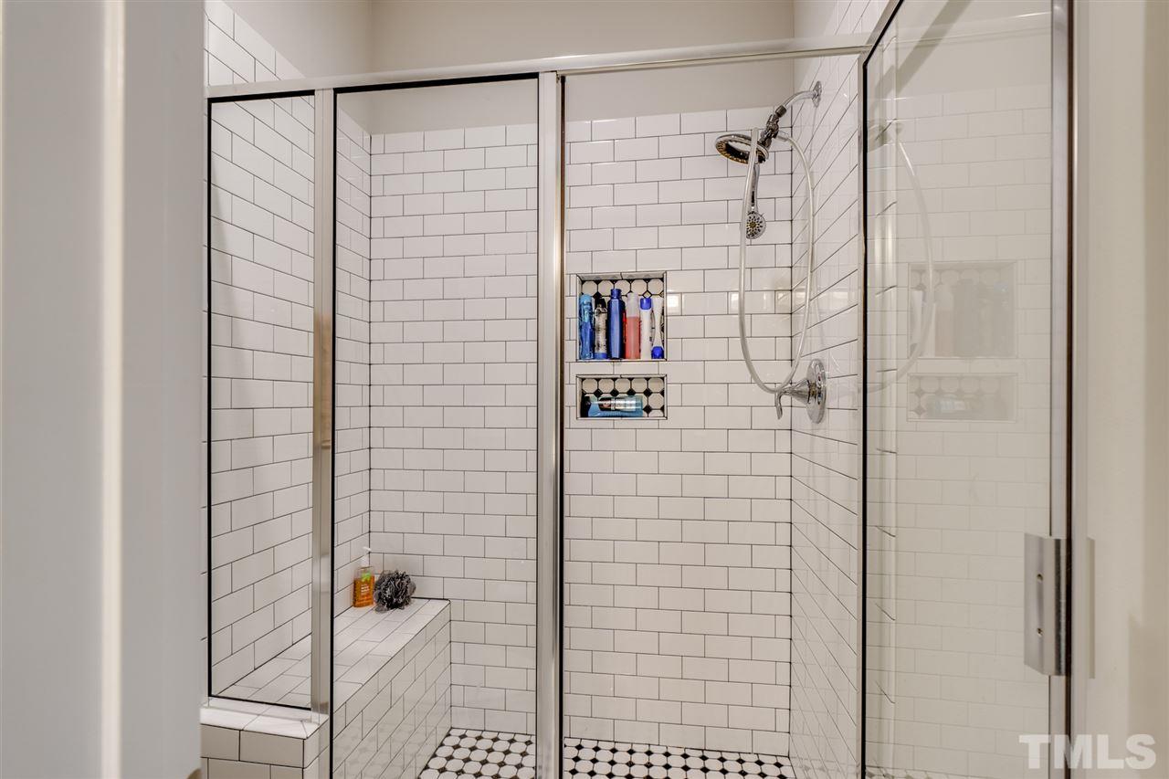 7504 Pinaster Place Raleigh, NC 27613 - Photo 20 of 30 a bathroom with a shower