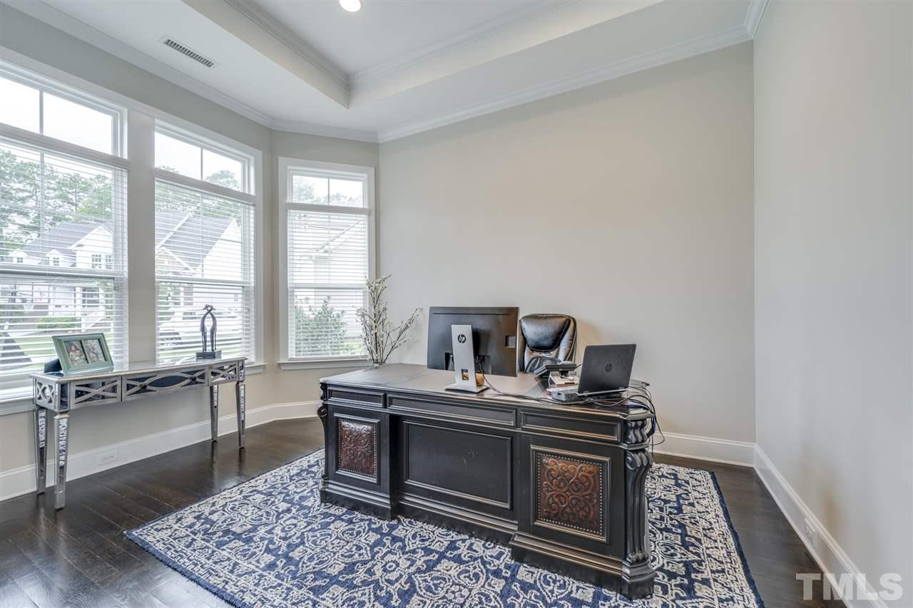 7504 Pinaster Place Raleigh, NC 27613 - Photo 3 of 30 a work room with furniture and windows