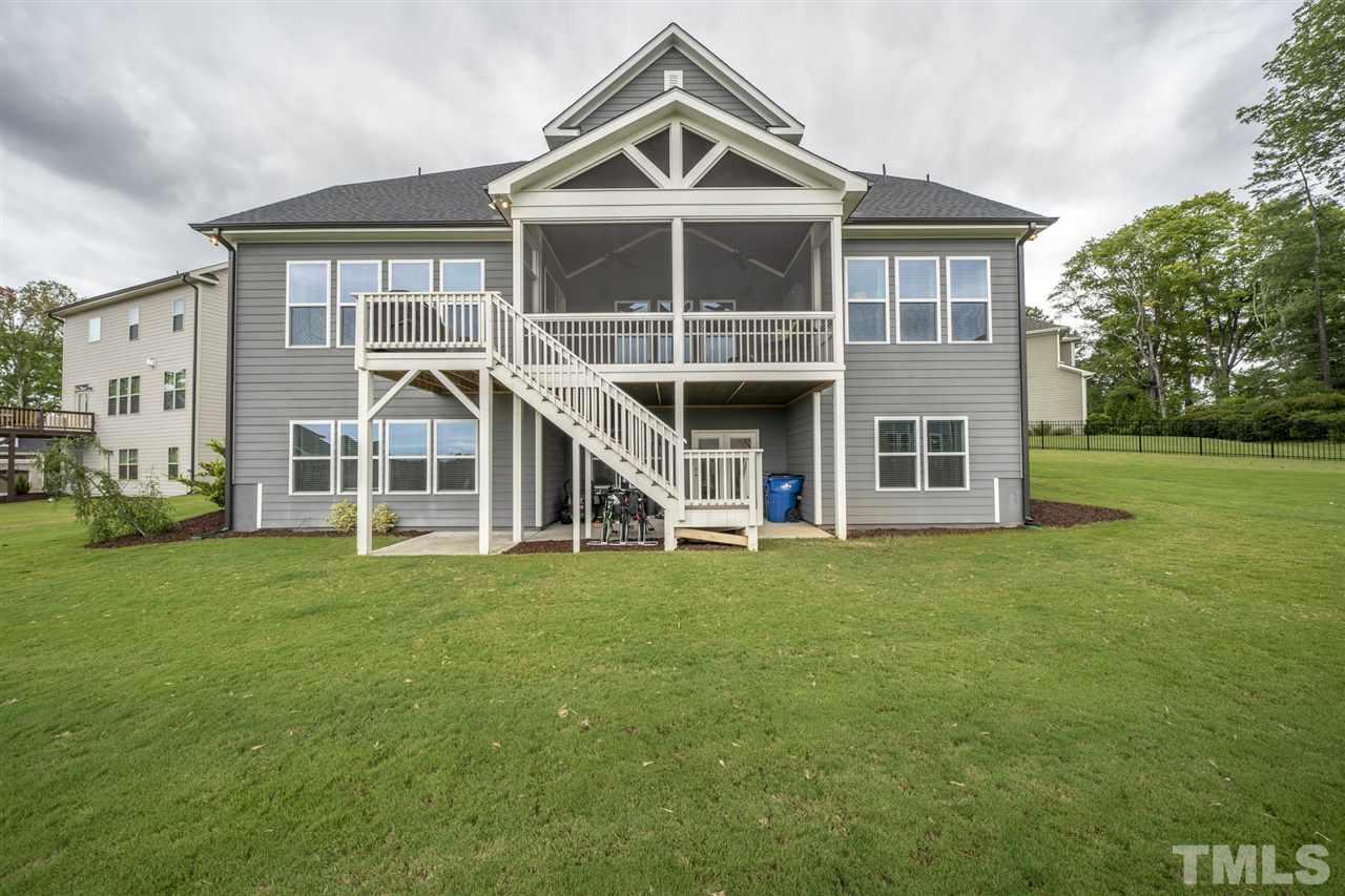 7504 Pinaster Place Raleigh, NC 27613 - Photo 28 of 30 a front view of a house with a yard