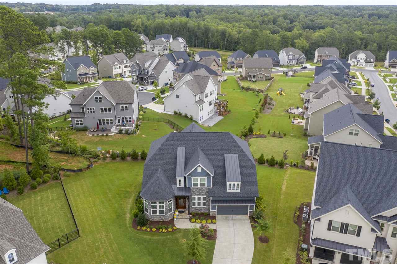 7504 Pinaster Place Raleigh, NC 27613 - Photo 30 of 30 an aerial view of a house with a swimming pool and mountains