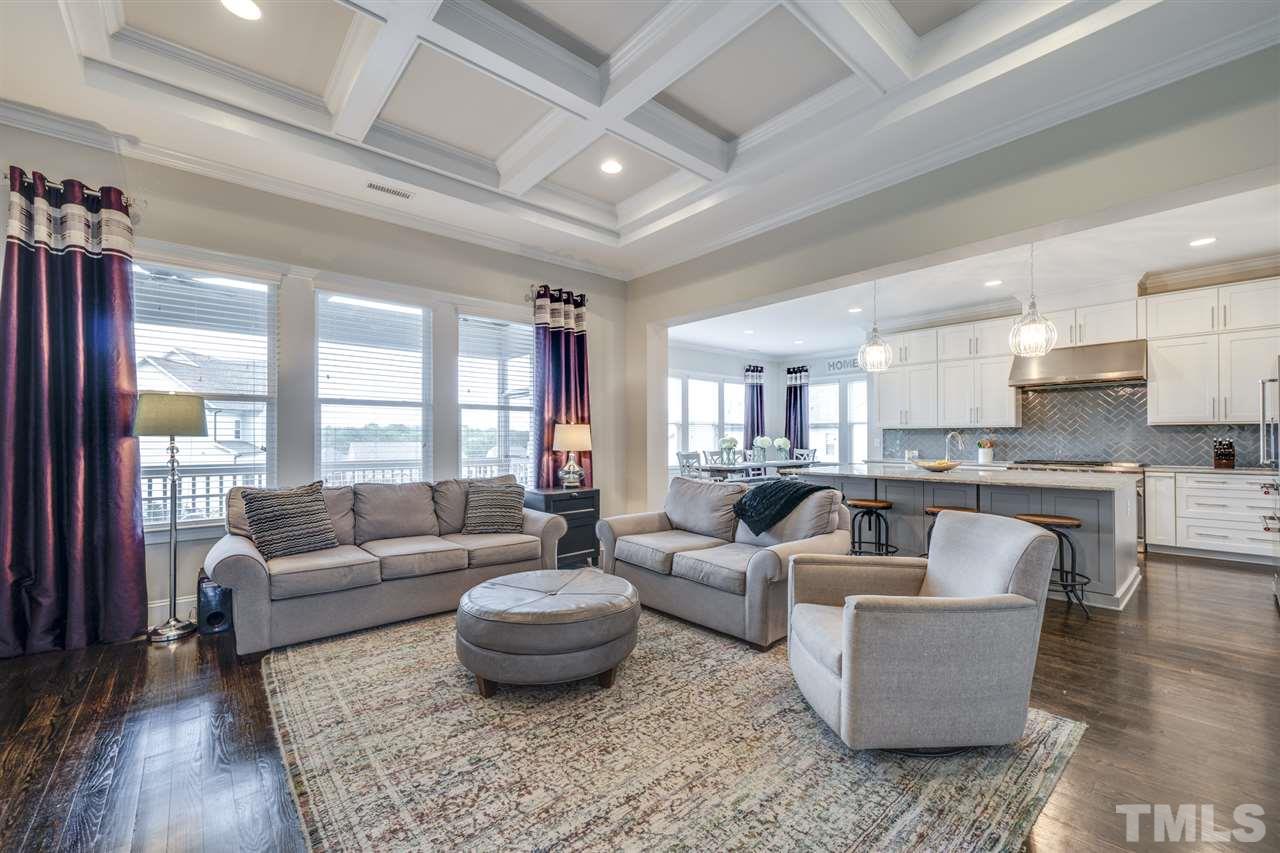 7504 Pinaster Place Raleigh, NC 27613 - Photo 6 of 30 a living room with furniture and a large window