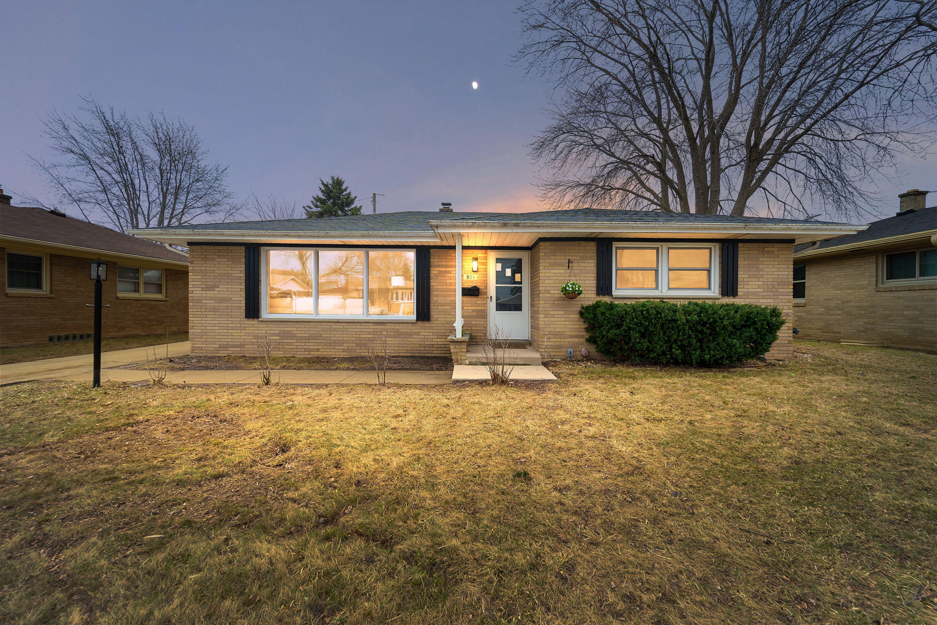 821 Saxony Drive Racine, WI 53402 - Photo 1 of 1 A timeless brick exterior welcomes you home, with warm lighting and inviting curb appeal that feels cozy from the moment you arrive
