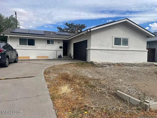 a house with trees in the background