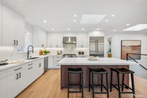 a view of a kitchen counter top space and living room