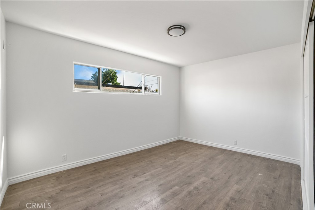 20554 Valerio Street Winnetka, CA 91306 - Photo 11 of 12 an empty room with a workbench