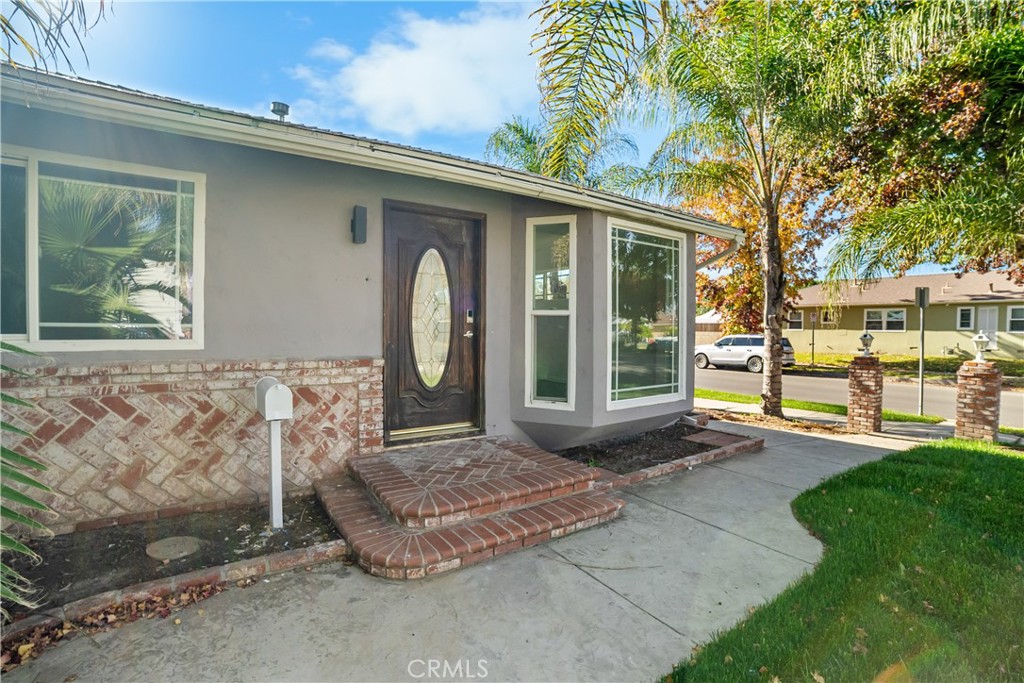 20554 Valerio Street Winnetka, CA 91306 - Photo 2 of 12 a front view of a house with garden