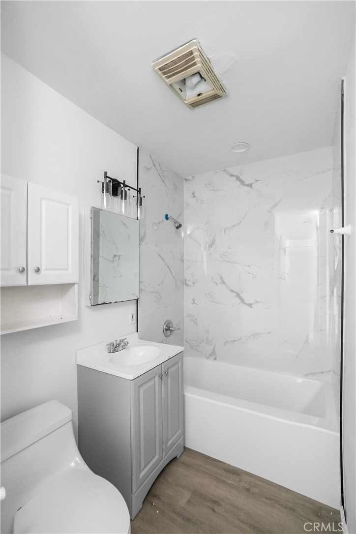 20554 Valerio Street Winnetka, CA 91306 - Photo 9 of 12 a bathroom with a sink a toilet and shower