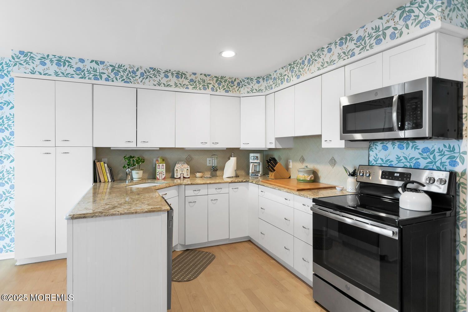 93 Bay Point Harbour Point Pleasant, NJ 08742 - Photo 17 of 49 a kitchen with stainless steel appliances granite countertop white cabinets sink and a granite counter top