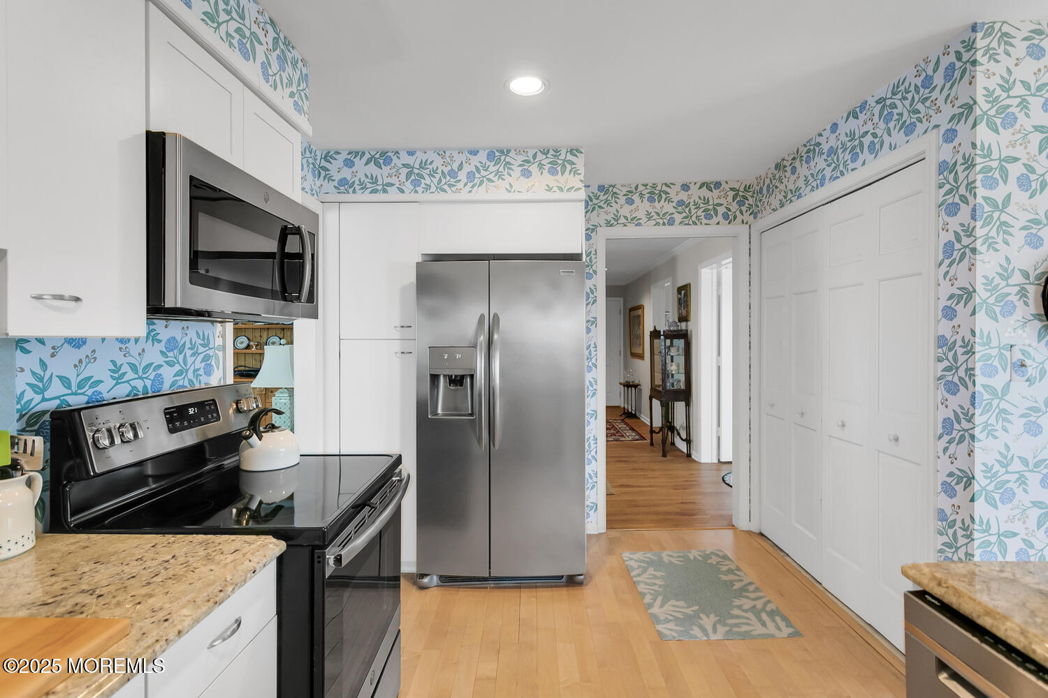 93 Bay Point Harbour Point Pleasant, NJ 08742 - Photo 18 of 49 a kitchen with stainless steel appliances granite countertop a refrigerator a stove and a sink with wooden floor