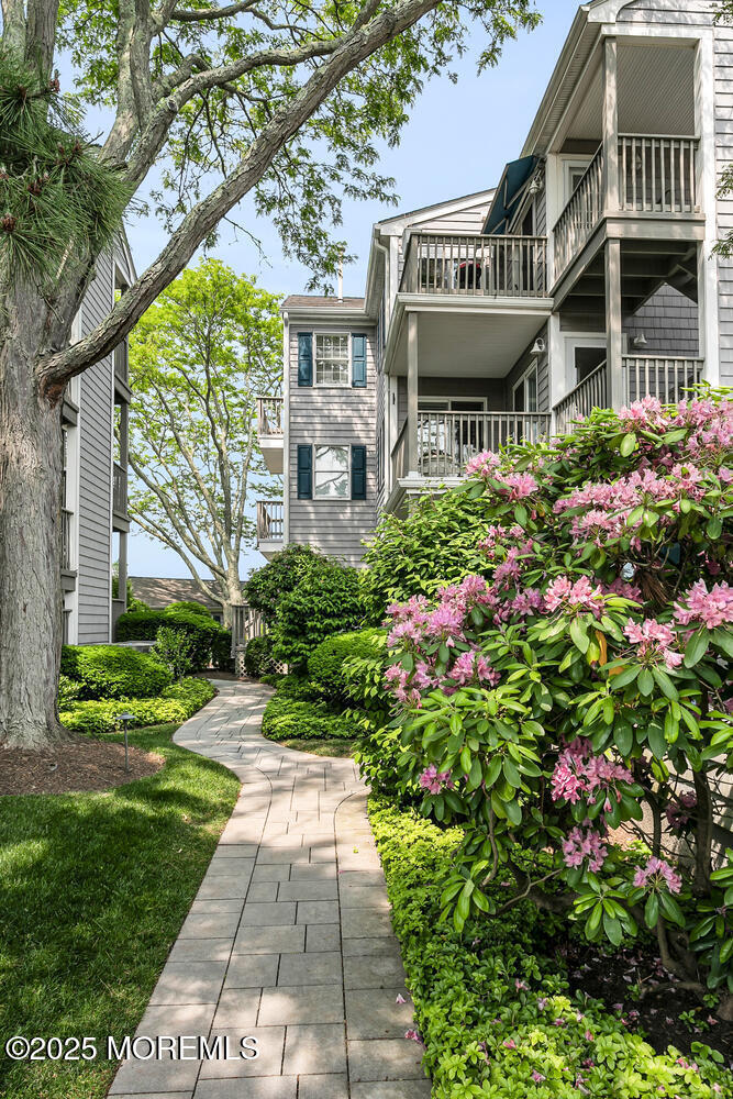93 Bay Point Harbour Point Pleasant, NJ 08742 - Photo 3 of 49 a front view of a building with a garden
