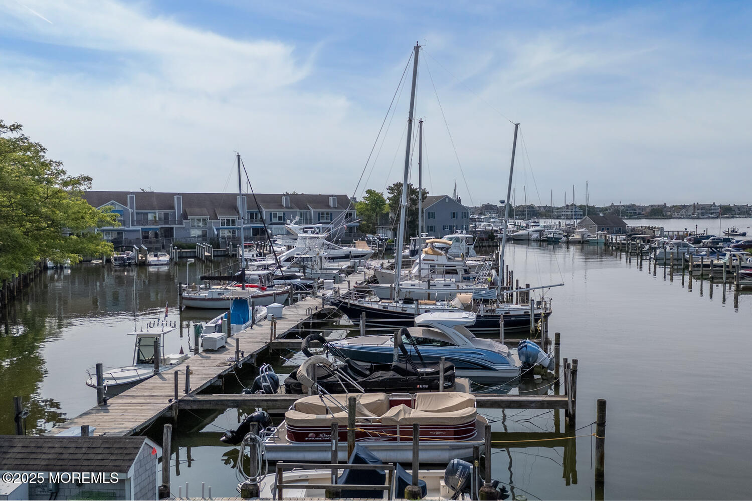 93 Bay Point Harbour Point Pleasant, NJ 08742 - Photo 36 of 49 a view of a lake with boats next to a bridge