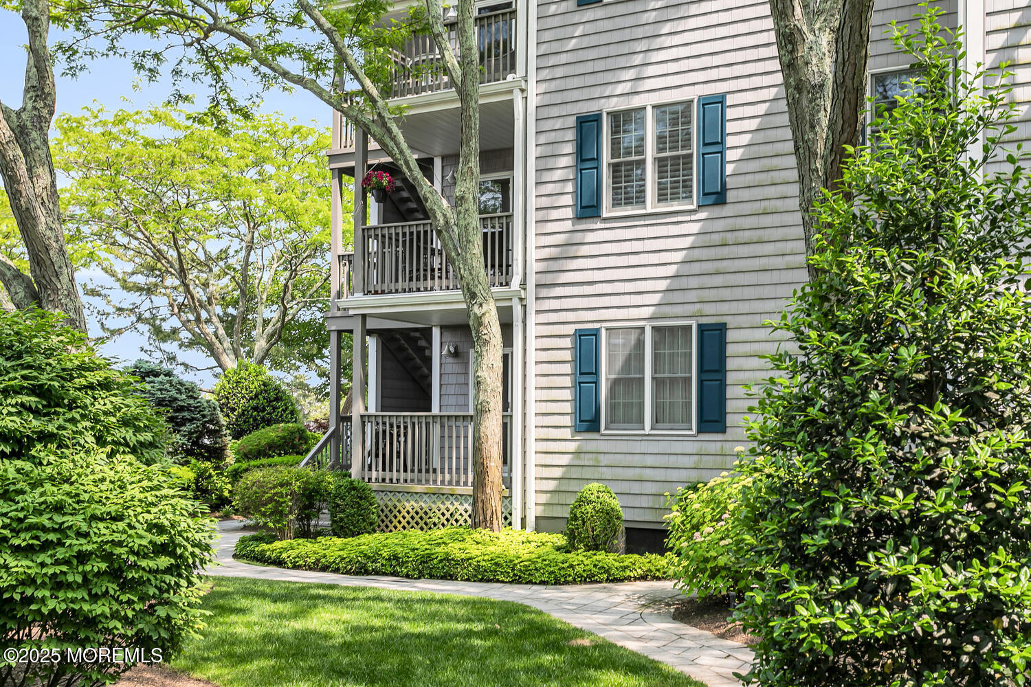 93 Bay Point Harbour Point Pleasant, NJ 08742 - Photo 4 of 49 a view of a house with brick walls and a small yard with plants