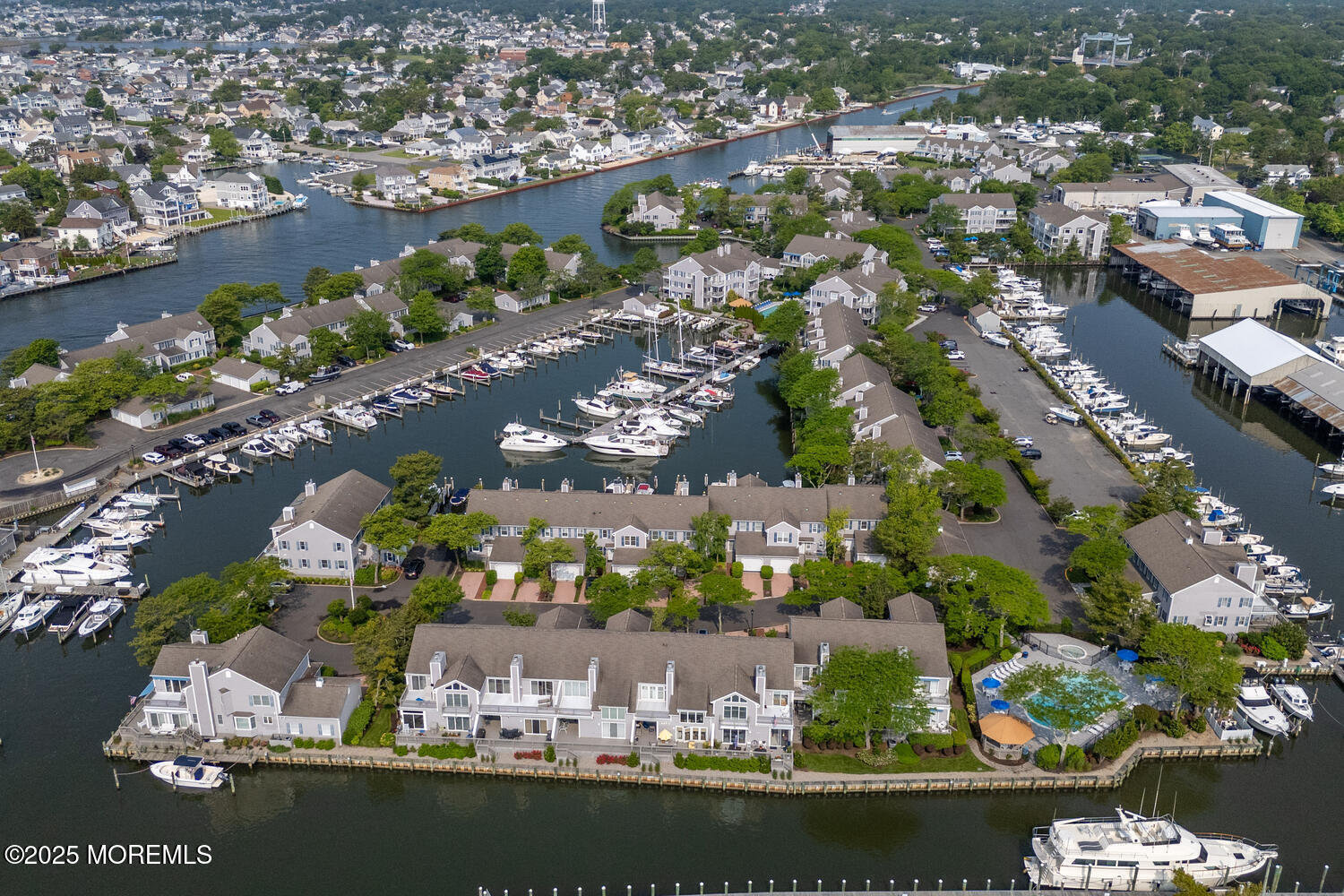 93 Bay Point Harbour Point Pleasant, NJ 08742 - Photo 44 of 49 an aerial view of a city with lots of residential buildings ocean and mountain view in back