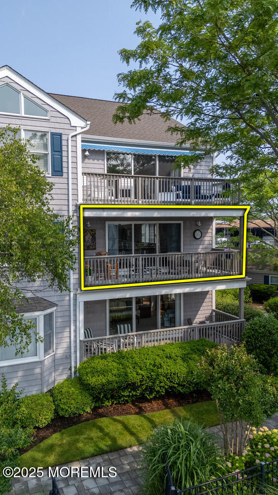 93 Bay Point Harbour Point Pleasant, NJ 08742 - Photo 5 of 49 a front view of residential houses with yard and green space