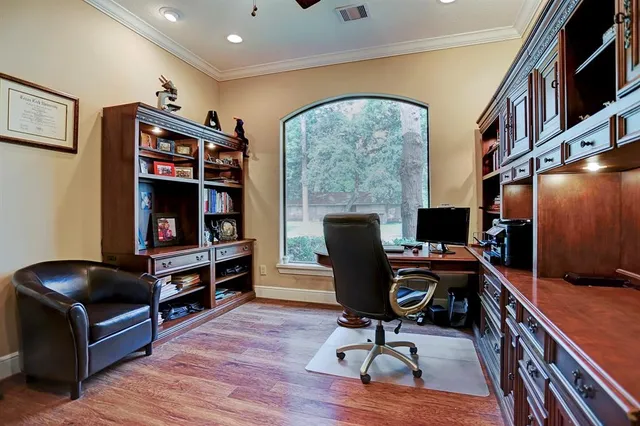 a livingroom with workspace and a couch