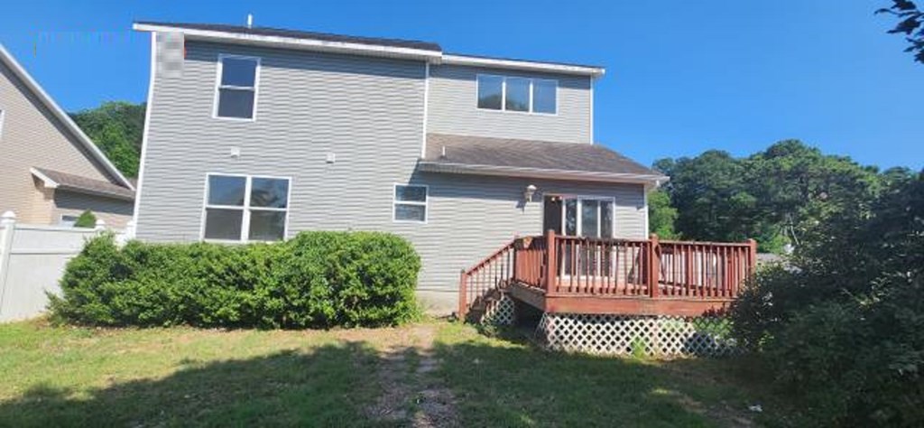 2402 Octopus Road Greenbackville, VA 23356 - Photo 17 of 21 a front view of a house with a garden