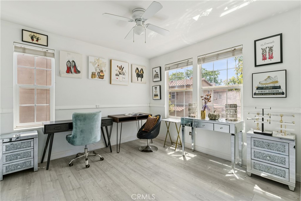 4155 Windspring Street Corona, CA 92883 - Photo 27 of 38 a view of a workspace with furniture and a window