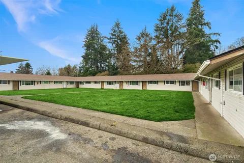 a view of a house with a yard