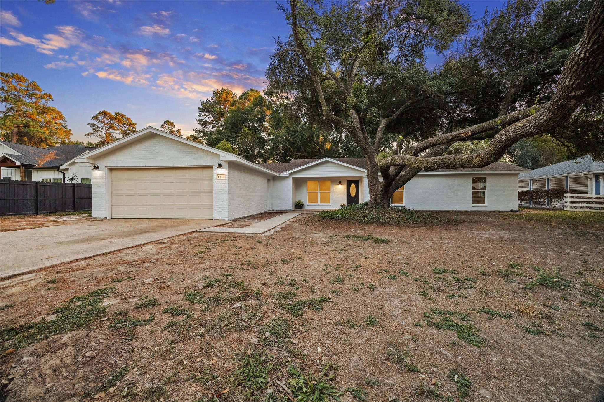 5411 Logston Lane Spring, TX 77389 - Photo 1 of 34 a front view of a house with a garden
