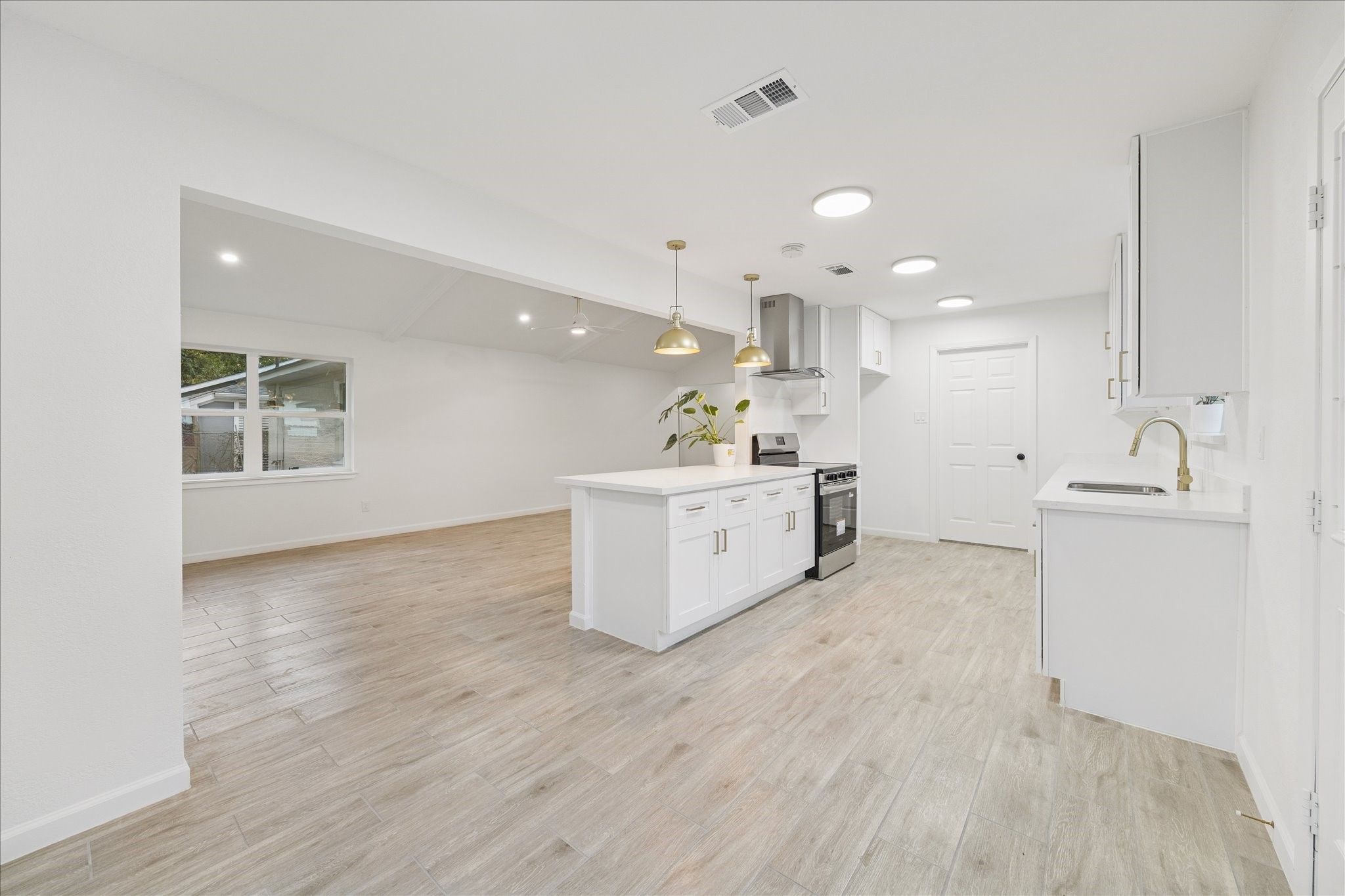 5411 Logston Lane Spring, TX 77389 - Photo 11 of 34 a large white kitchen with a large window