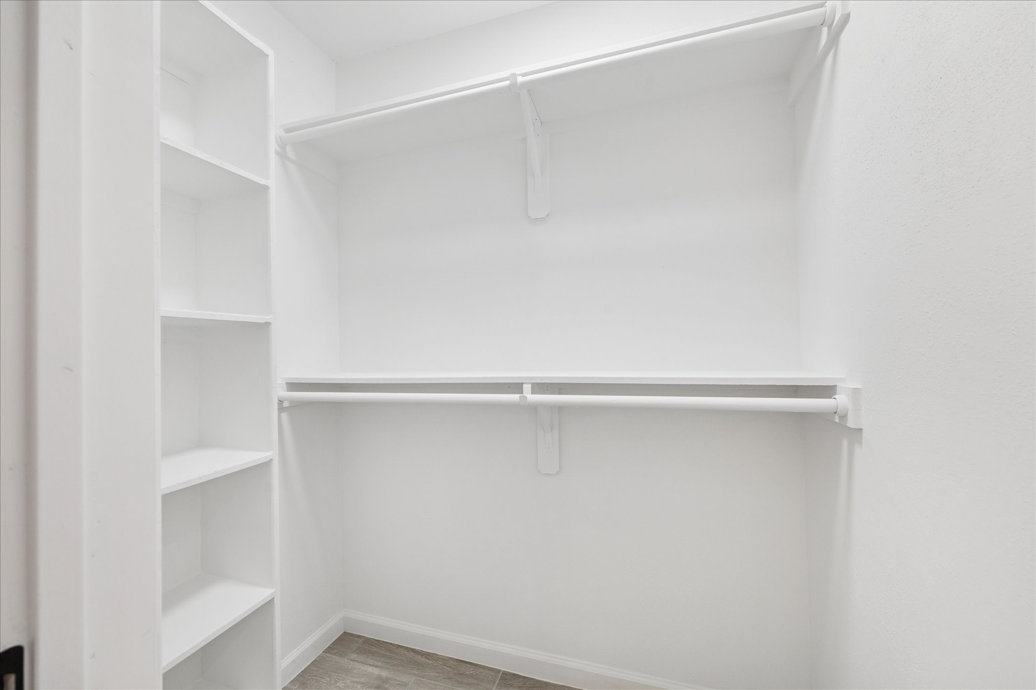 5411 Logston Lane Spring, TX 77389 - Photo 18 of 34 a view of an empty walk in closet