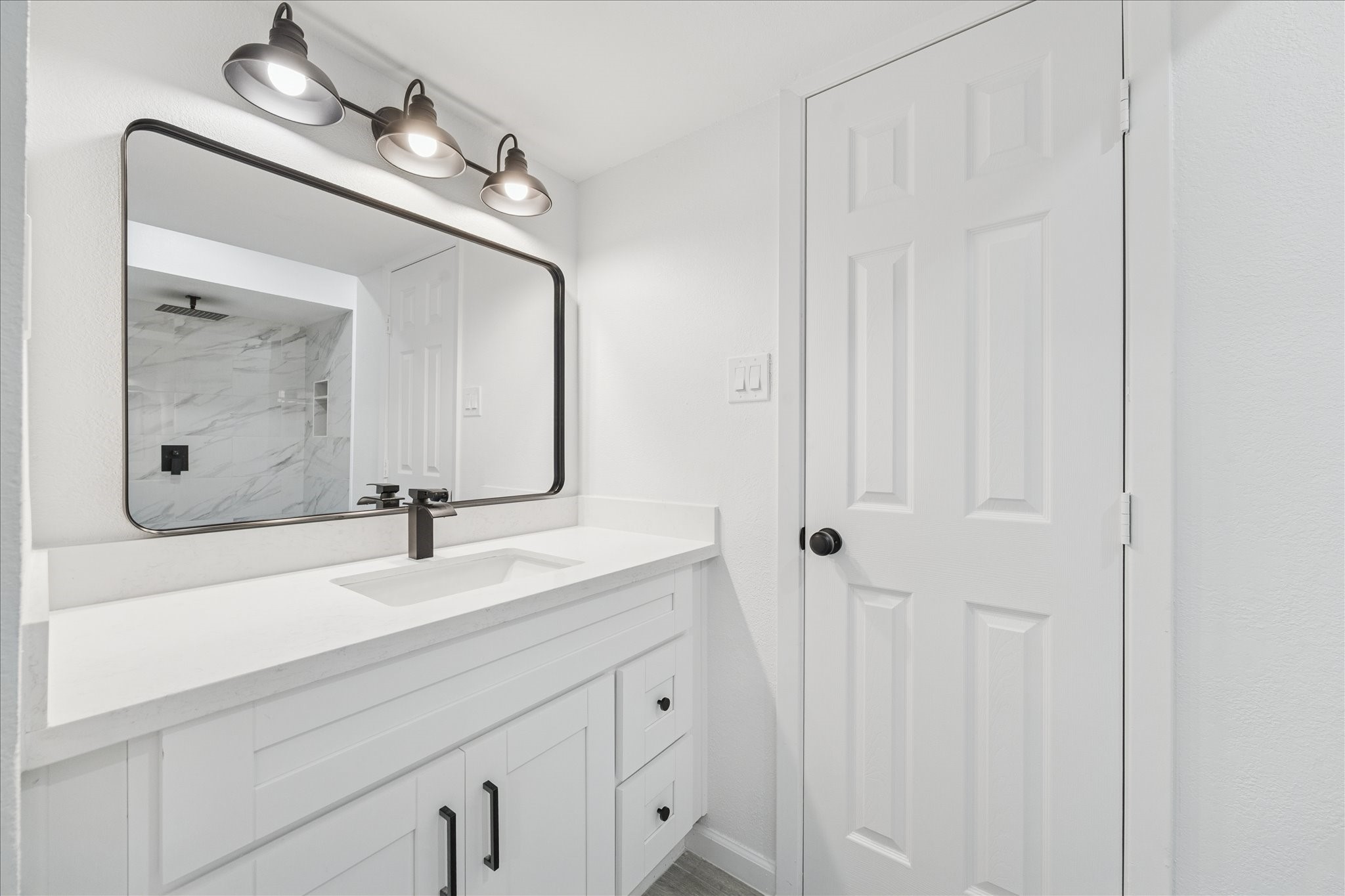 5411 Logston Lane Spring, TX 77389 - Photo 21 of 34 a bathroom with a granite countertop sink and a mirror
