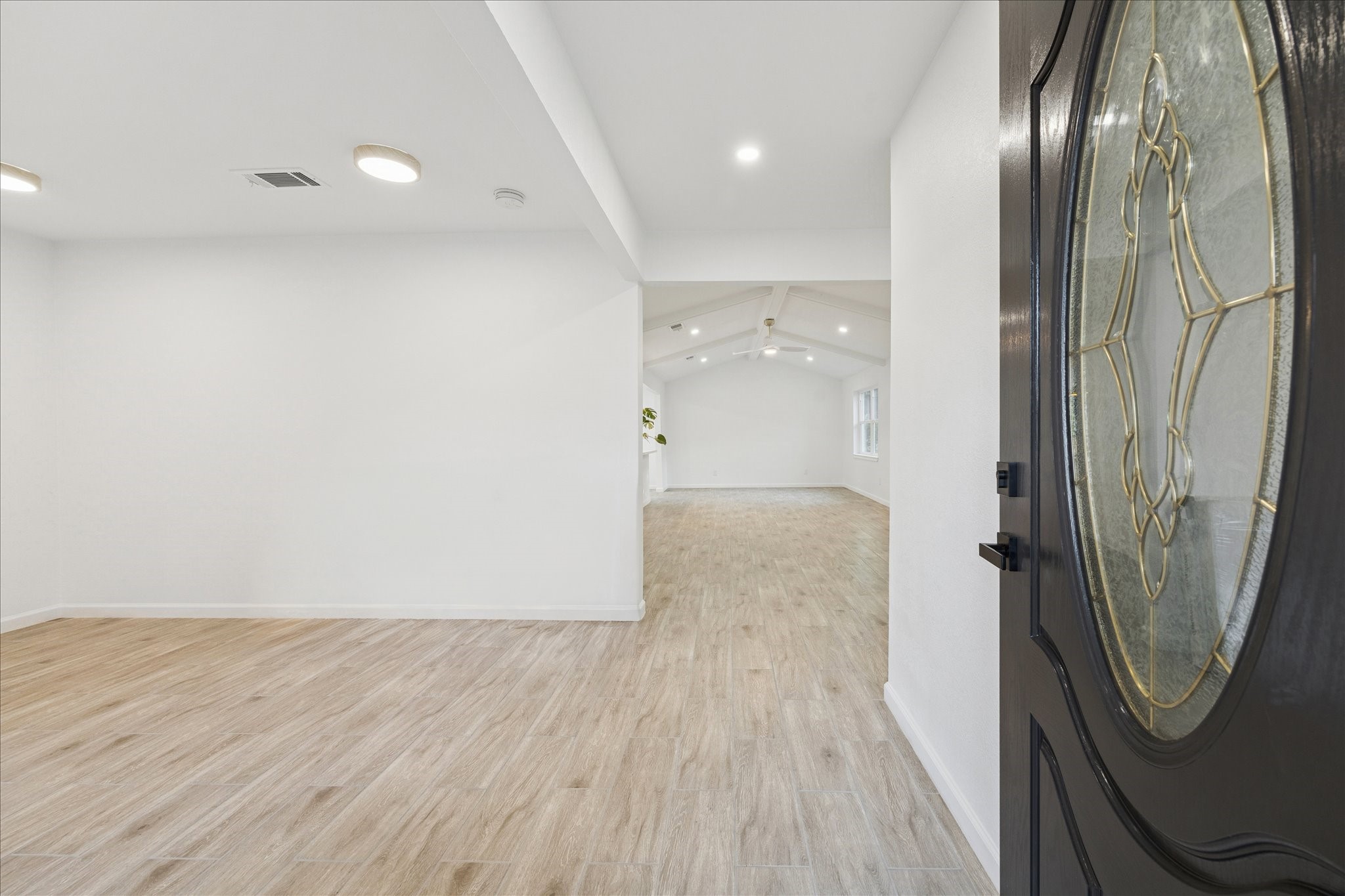 5411 Logston Lane Spring, TX 77389 - Photo 5 of 34 an empty room with wooden floor and mirror