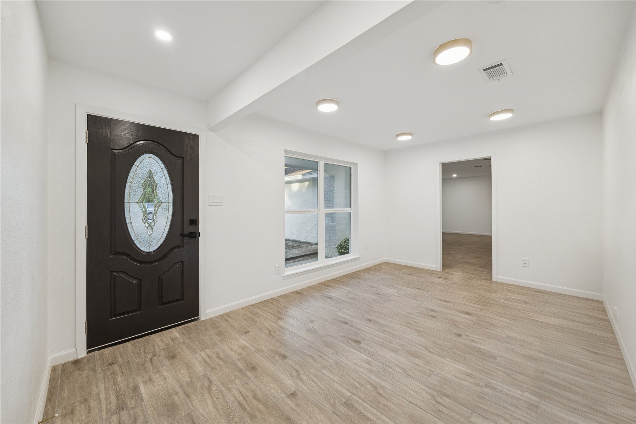 5411 Logston Lane Spring, TX 77389 - Photo 6 of 34 an empty room with mirror and a window