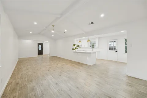 a view of a big room with wooden floor