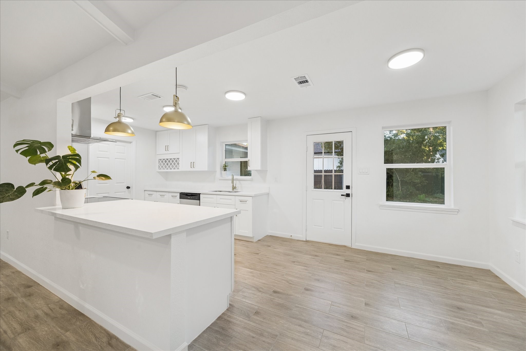 5411 Logston Lane Spring, TX 77389 - Photo 10 of 34 a kitchen with a sink a stove and cabinets