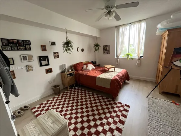 a bedroom with double bed and a window