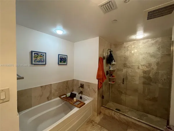 a bathroom with a sink and a shower