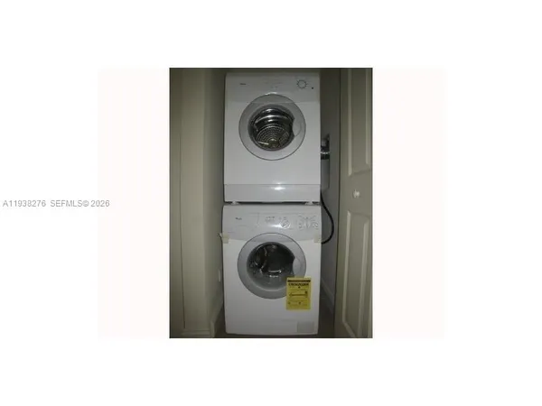 a bathroom with a sink and a washer