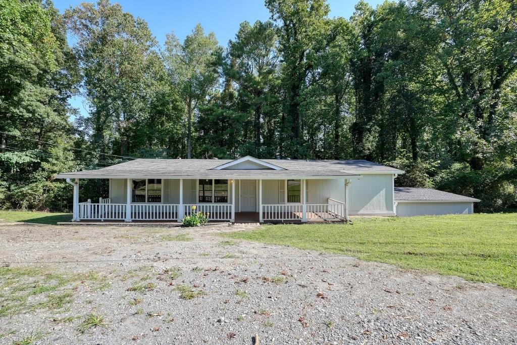 252 Bill Jordan Lane Ball Ground, GA 30107 - Photo 1 of 1 a front view of a house with a garden