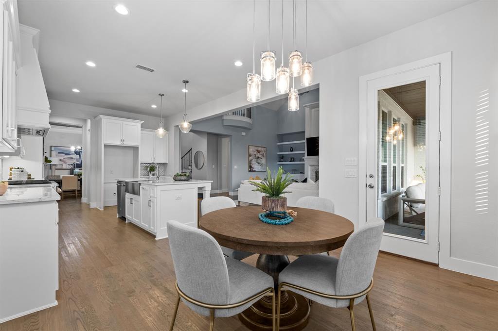 4003 Marble Hill Road Frisco, TX 75034 - Photo 14 of 40 a open dining room with furniture wooden floor and kitchen view