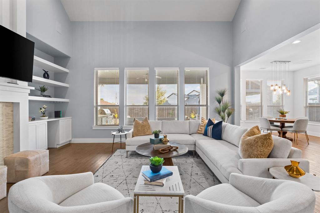 4003 Marble Hill Road Frisco, TX 75034 - Photo 16 of 40 a living room with furniture and a flat screen tv