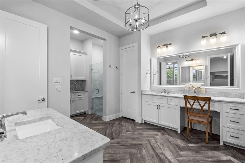 4003 Marble Hill Road Frisco, TX 75034 - Photo 22 of 40 a spacious bathroom with a granite countertop sink mirror and toilet