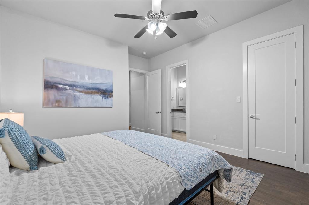 4003 Marble Hill Road Frisco, TX 75034 - Photo 24 of 40 a bedroom with a bed and a chandelier