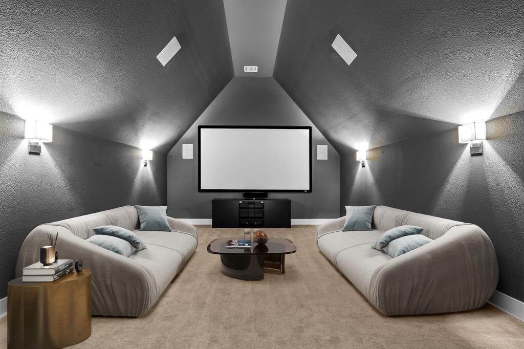 4003 Marble Hill Road Frisco, TX 75034 - Photo 28 of 40 a living room with furniture and a projector