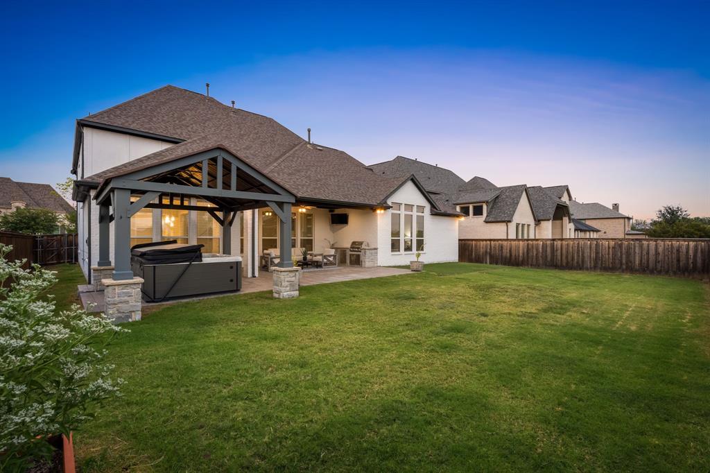4003 Marble Hill Road Frisco, TX 75034 - Photo 36 of 40 a front view of a house with a garden and yard