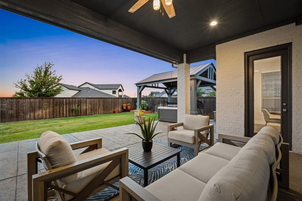 4003 Marble Hill Road Frisco, TX 75034 - Photo 37 of 40 a view of a patio with couches chairs dining table and chairs
