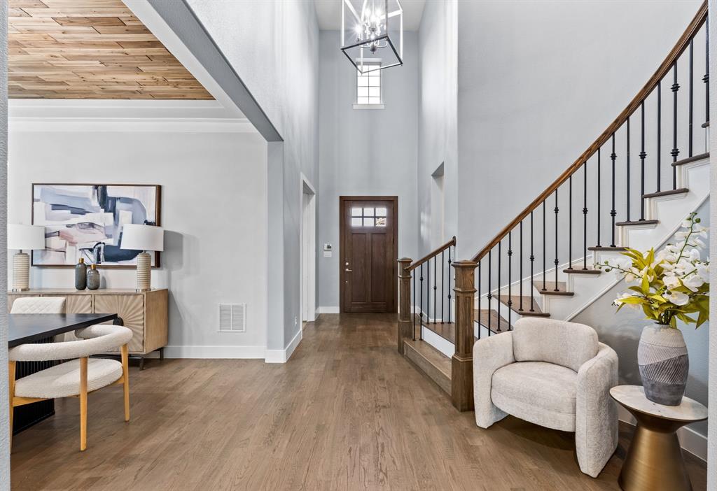 4003 Marble Hill Road Frisco, TX 75034 - Photo 4 of 40 a view of staircase with furniture and a chandelier