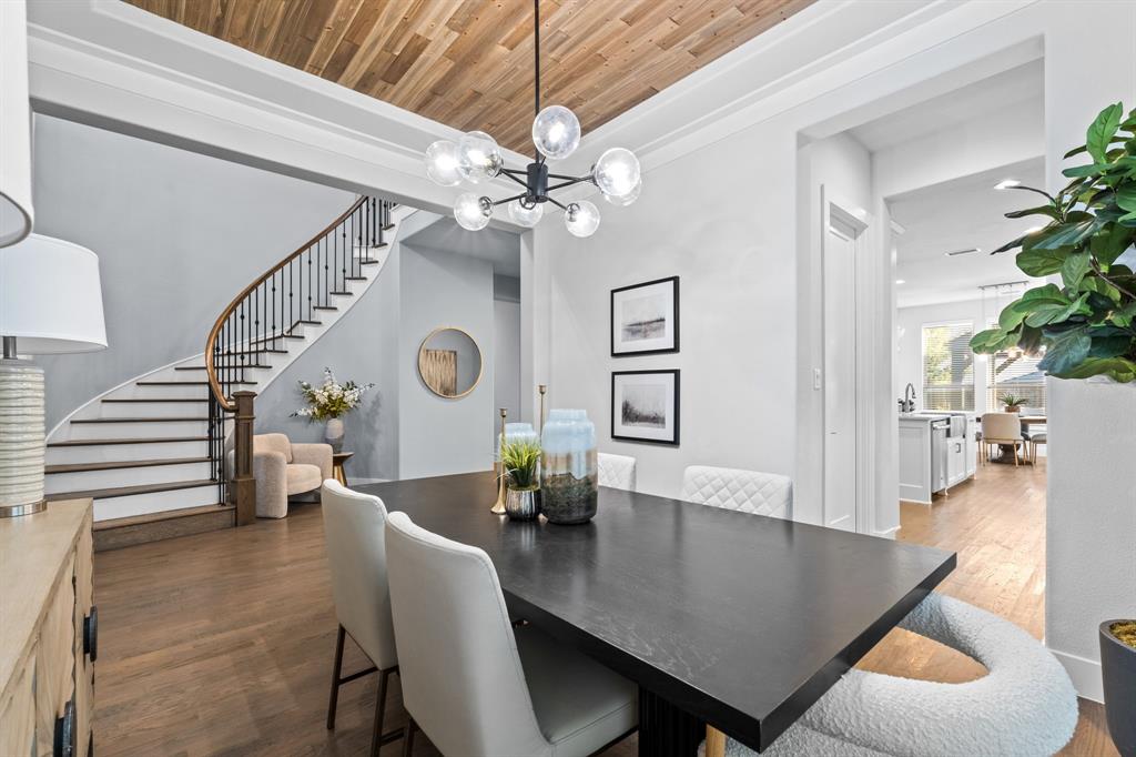 4003 Marble Hill Road Frisco, TX 75034 - Photo 8 of 40 a view of a dining room with furniture and a chandelier