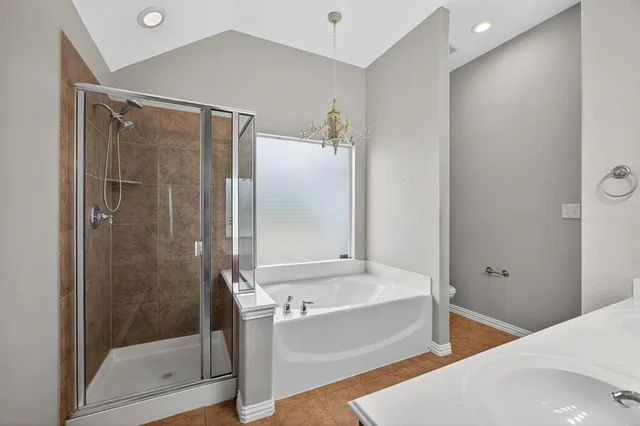 a bathroom with a bathtub and a shower