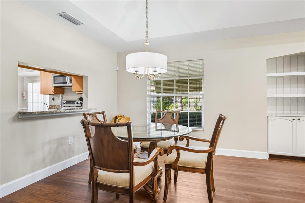 4016 Oakley Greene, Unit 40 Sarasota, FL 34235 - Photo 16 of 51 a dining room with furniture and window