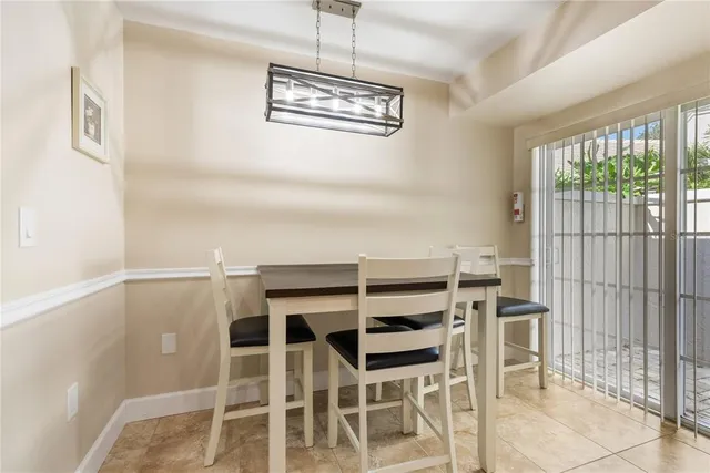 a view of a house with pool and chairs