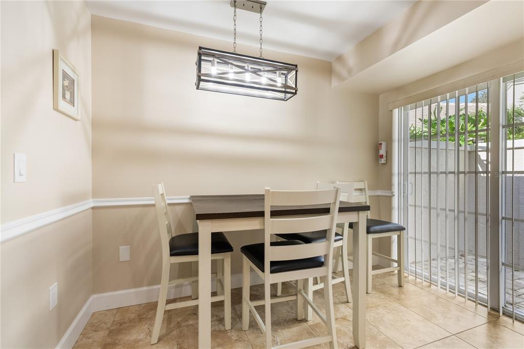 4016 Oakley Greene, Unit 40 Sarasota, FL 34235 - Photo 18 of 51 a view of a dining room with furniture window and outside view