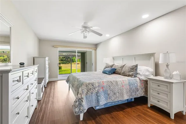 an aerial view of residential house with outdoor space and trees all around